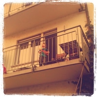 j singing on the balcony.