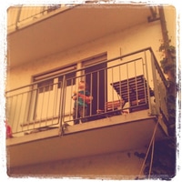 j singing on the balcony.