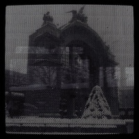 snowy lucerne through the bus ad-plastered window